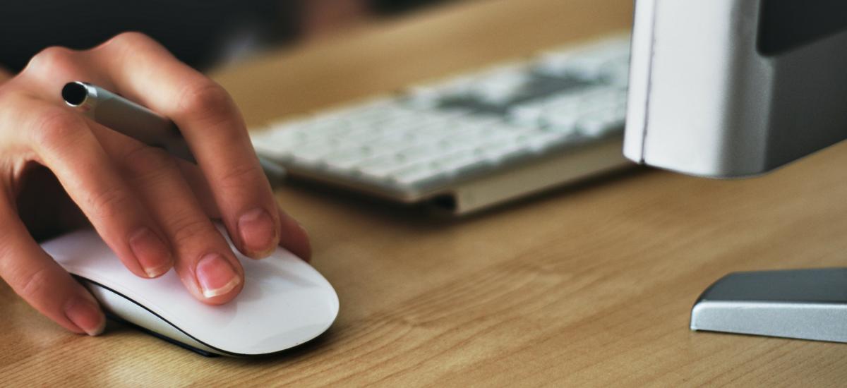 Person about to click using a computer mouse