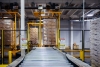 Automated cold storage pallet handling system using advanced computer vision technology for efficient material processing.