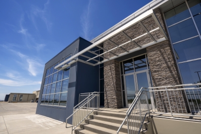 A new cold storage building entrance against a bright blue sky
